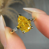 "Avenqor" Yellow 1.52 Carat Pear Cut Trilogy Lab Grown Diamond Engagement Ring HLM520 HEERA DIAMONDS