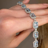Emerald Shape 11 Carat Aquamarine Tennis Bracelet Featuring Diamond Halo BRHAEC HEERA DIAMONDS