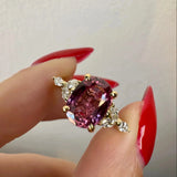 "Moondust" Oval Cut 1.5 Carat Diamond Shoulder Fancy Vivid Pink Yellow Gold Engagement Ring Life style- front view