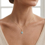 Oval Aquamrine Pendant with Diamond Halo