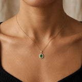 Oval Emerald Cluster Pendant with Diamond Halo