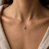 Oval Tanzanite Pendant with Diamond Halo