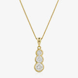 Round cut solitaire in three stone rub over setting HEERA