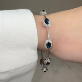 Oval Shape 9 Carat Sapphire Featuring 2.3 Carat Natural Diamond Halo 18K White Gold Station Set Bracelet