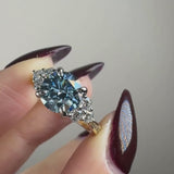 "Kiara" Round Cut Blue Diamond 2.5 Carat Lab Grown Diamond Shoulder Yellow Gold Engagement Ring